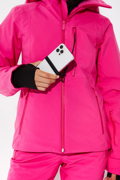 Woman wearing Alpenglow ski jacket