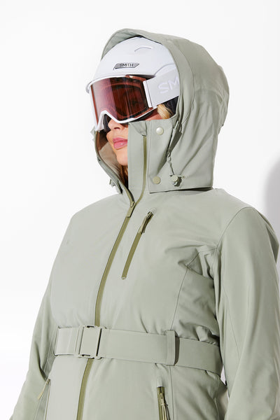 Woman wearing Sage belted jacket