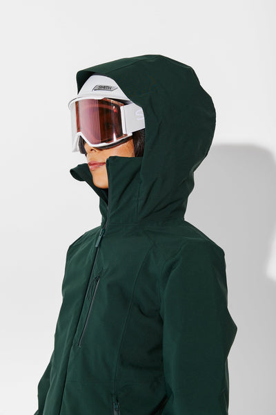 Woman wearing Alpine Green ski jacket