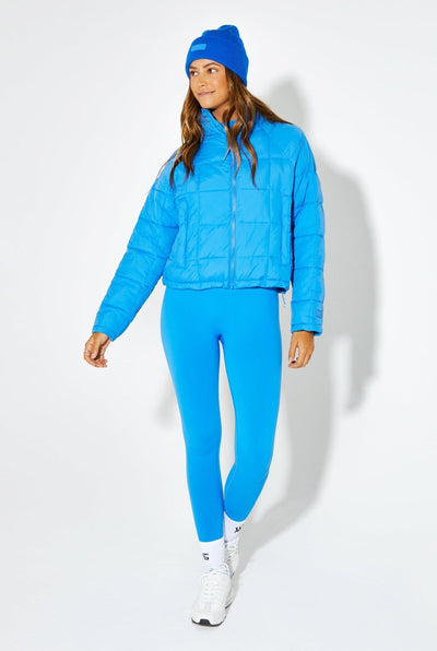 Woman Wearing Blue Bird Nellie Packable Puffer