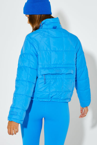 Woman Wearing Blue Bird Nellie Packable Puffer