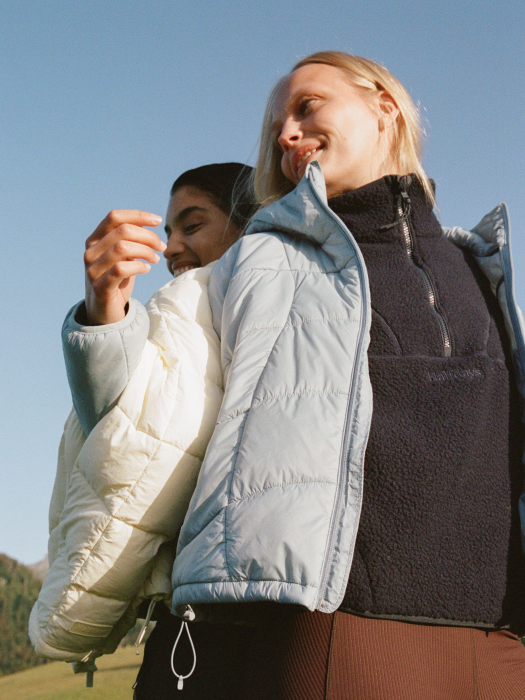 Two girls wearing halfdays fall product in the mountains having a great time 