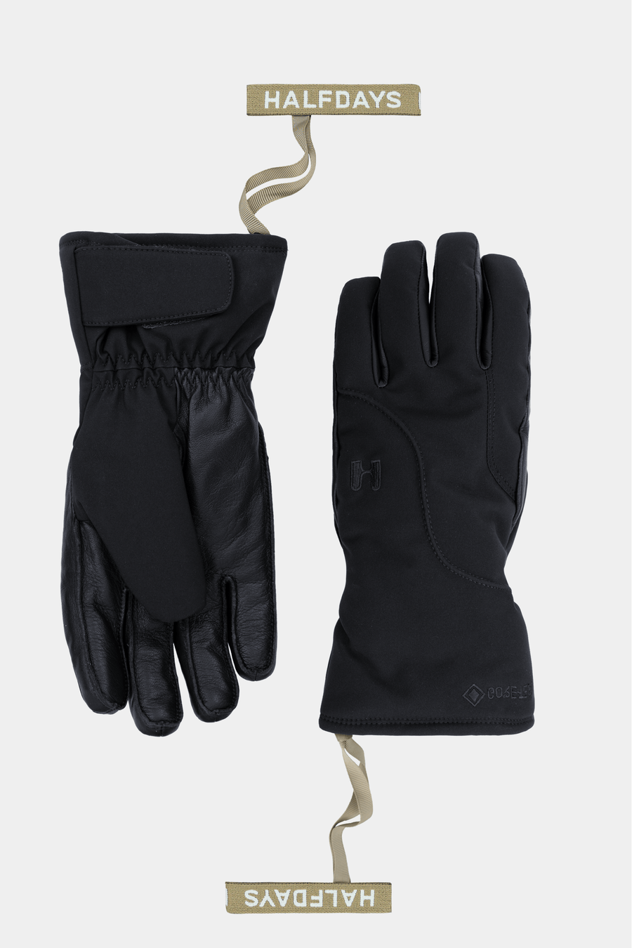 A pair of black outdoor gloves shown flat against a light gray background, one glove facing palm side and the other showing the back. Each glove is attached to a beige wire hanger with a tan label reading HALFDAYS.