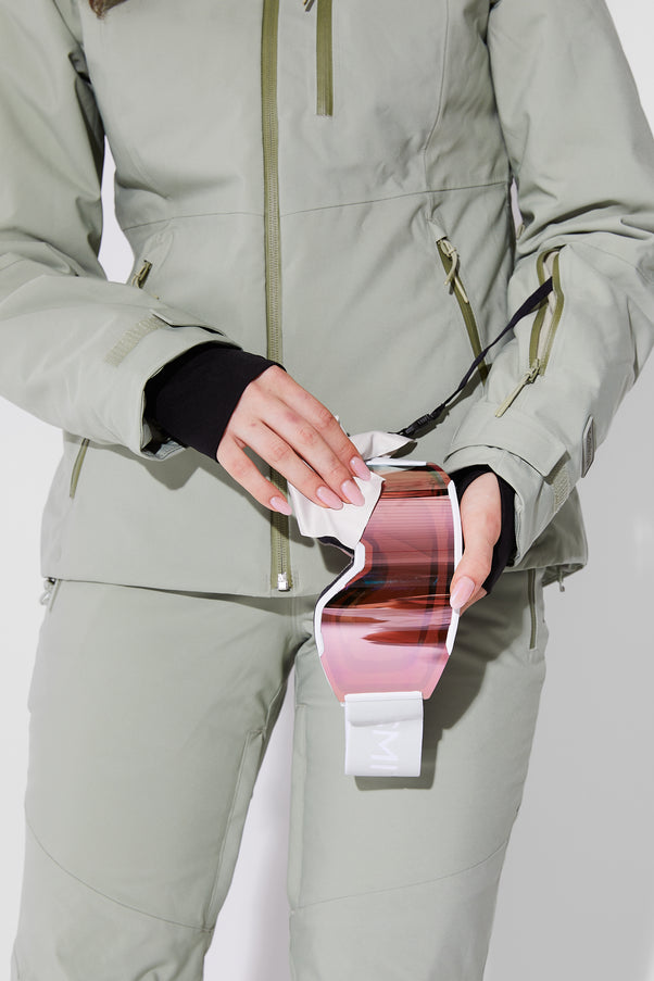 Woman wearing Sage ski jacket
