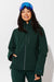 Woman wearing Alpine Green ski jacket