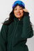 Woman wearing Alpine Green ski jacket