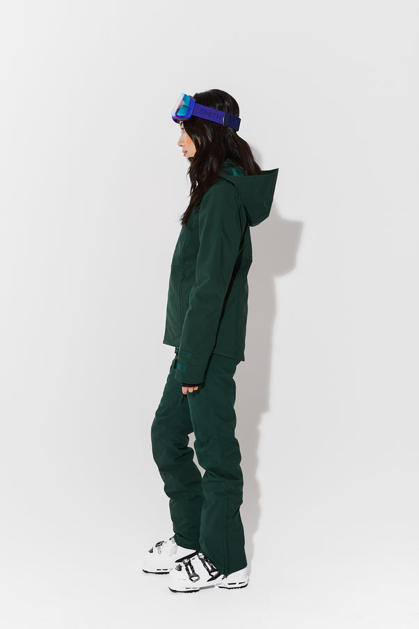 Woman wearing Alpine Green ski jacket
