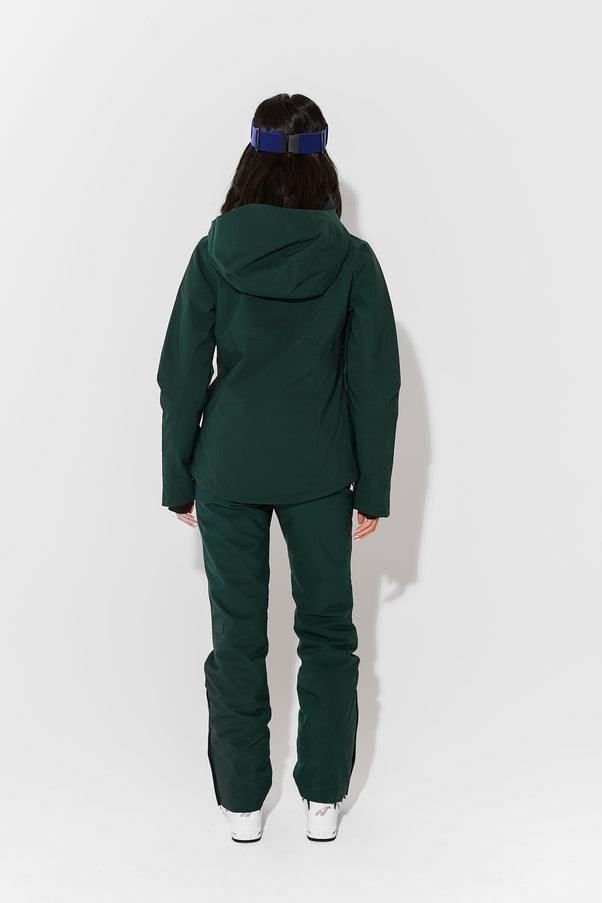 Woman wearing Alpine Green ski jacket