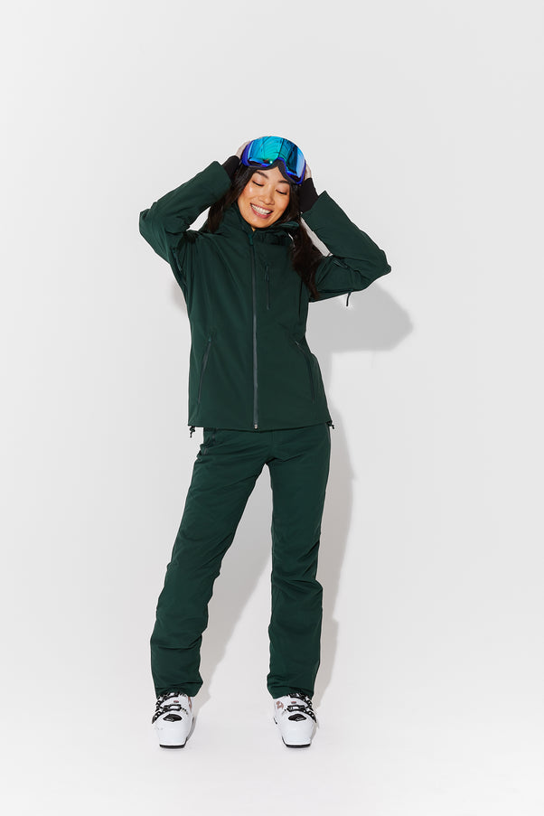 Woman wearing Alpine Green ski jacket