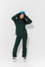 Woman wearing Alpine Green ski jacket