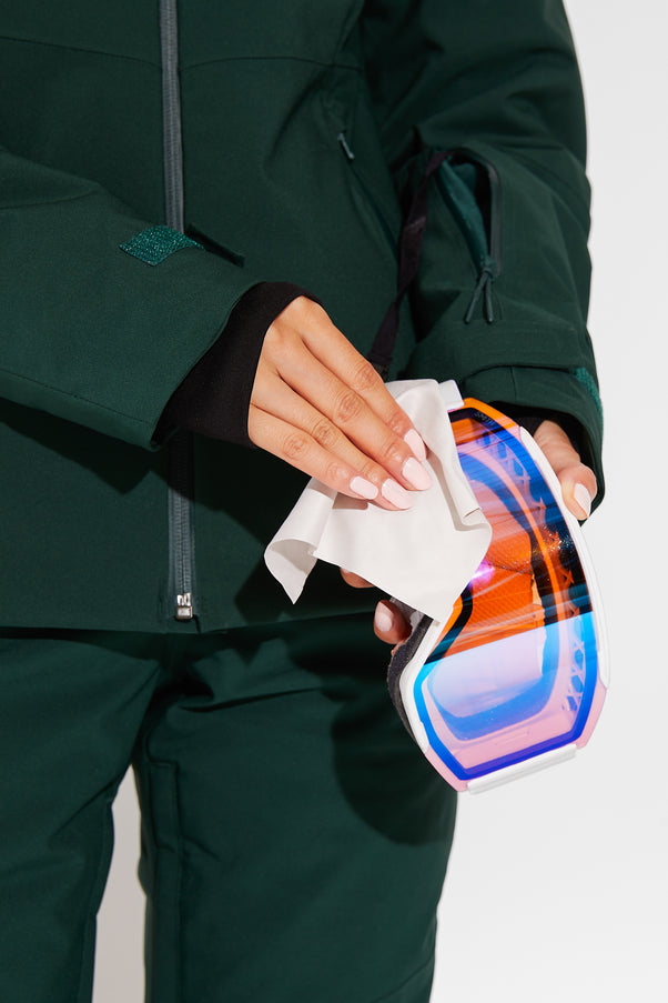 Woman wearing Alpine Green ski jacket