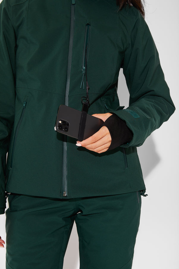 Woman wearing Alpine Green ski jacket