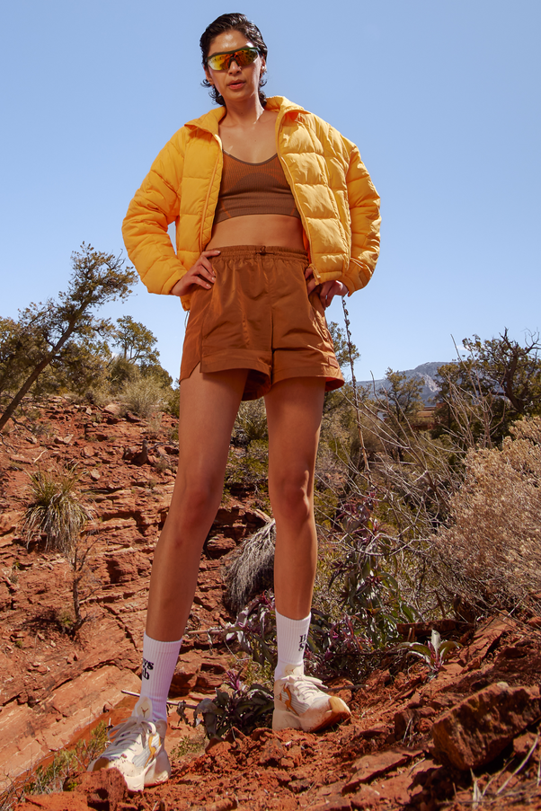 Woman Wearing Caramel Colored Nylon Shorts