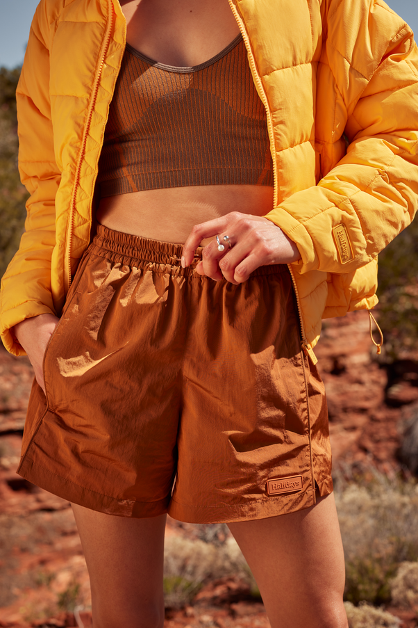 Woman Wearing Caramel Colored Nylon Shorts