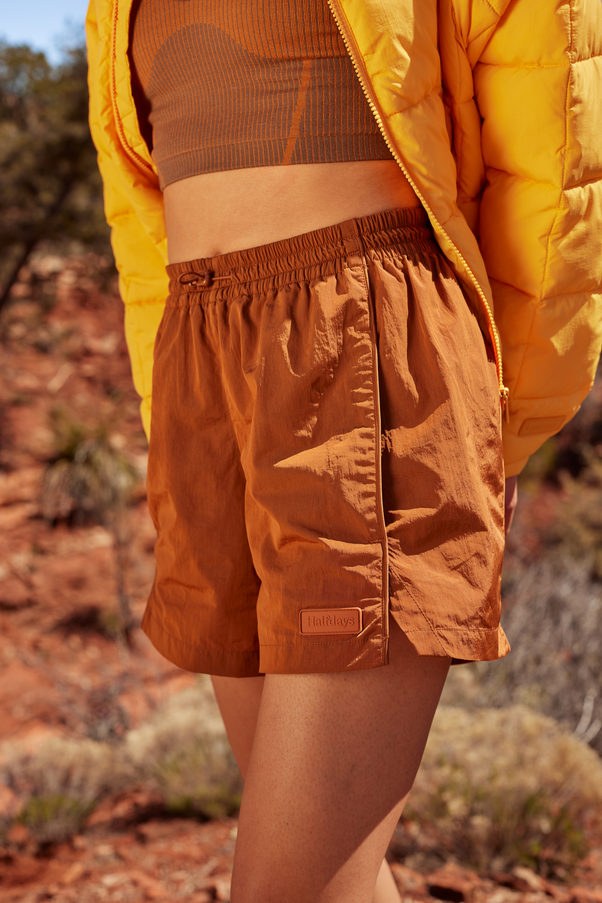Woman Wearing Caramel Colored Nylon Shorts
