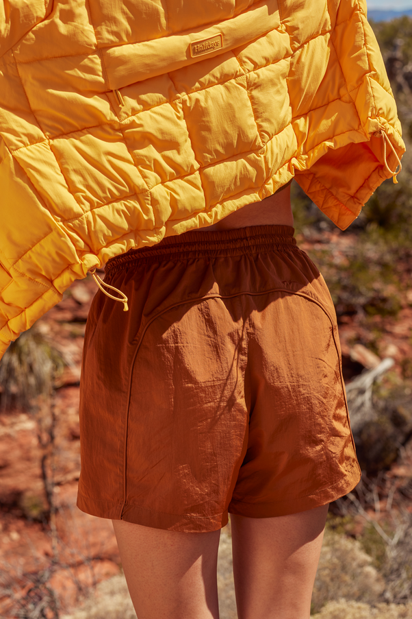 Woman Wearing Caramel Colored Nylon Shorts