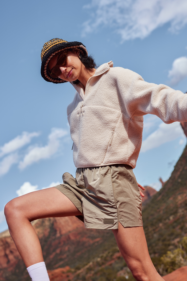 Woman Wearing Lava Rock Gray Colored Nylon Shorts