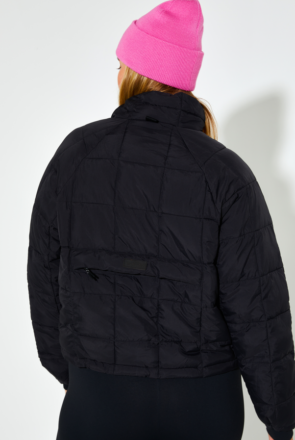 Woman Wearing Black Nellie Packable Puffer
