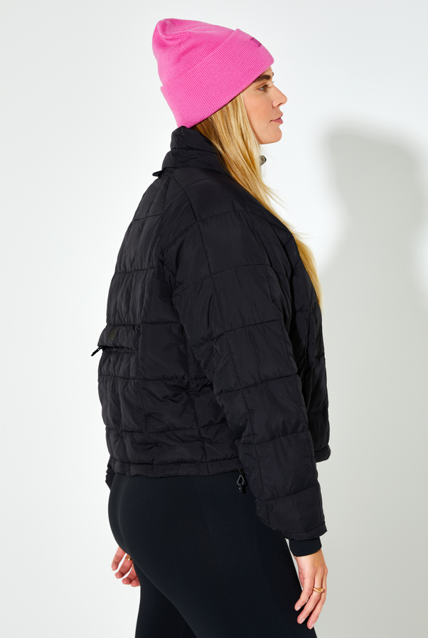 Woman Wearing Black Nellie Packable Puffer