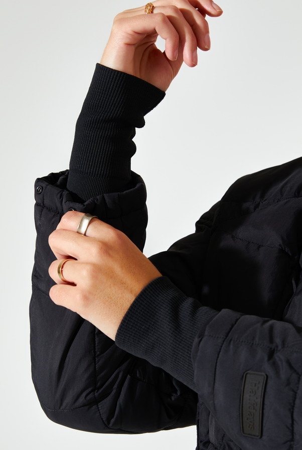 Woman Wearing Black Nellie Packable Puffer