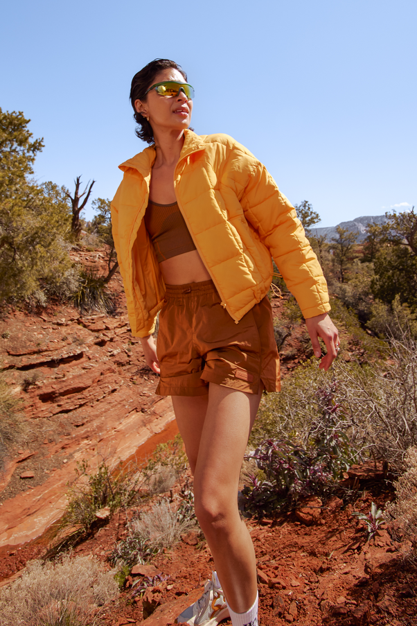 Woman Wearing Creamsicle Nellie Packable Puffer