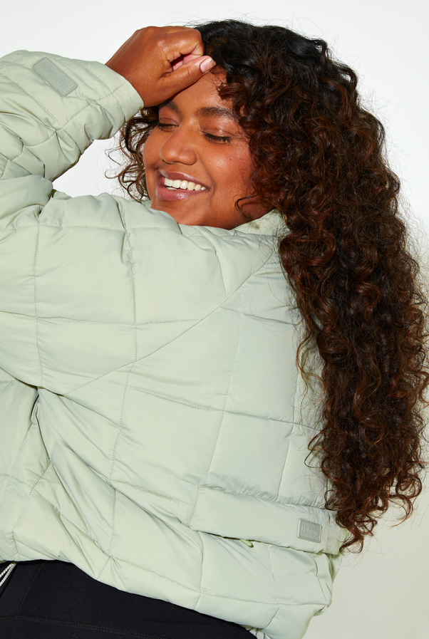 Woman Wearing Sage Nellie Packable Puffer
